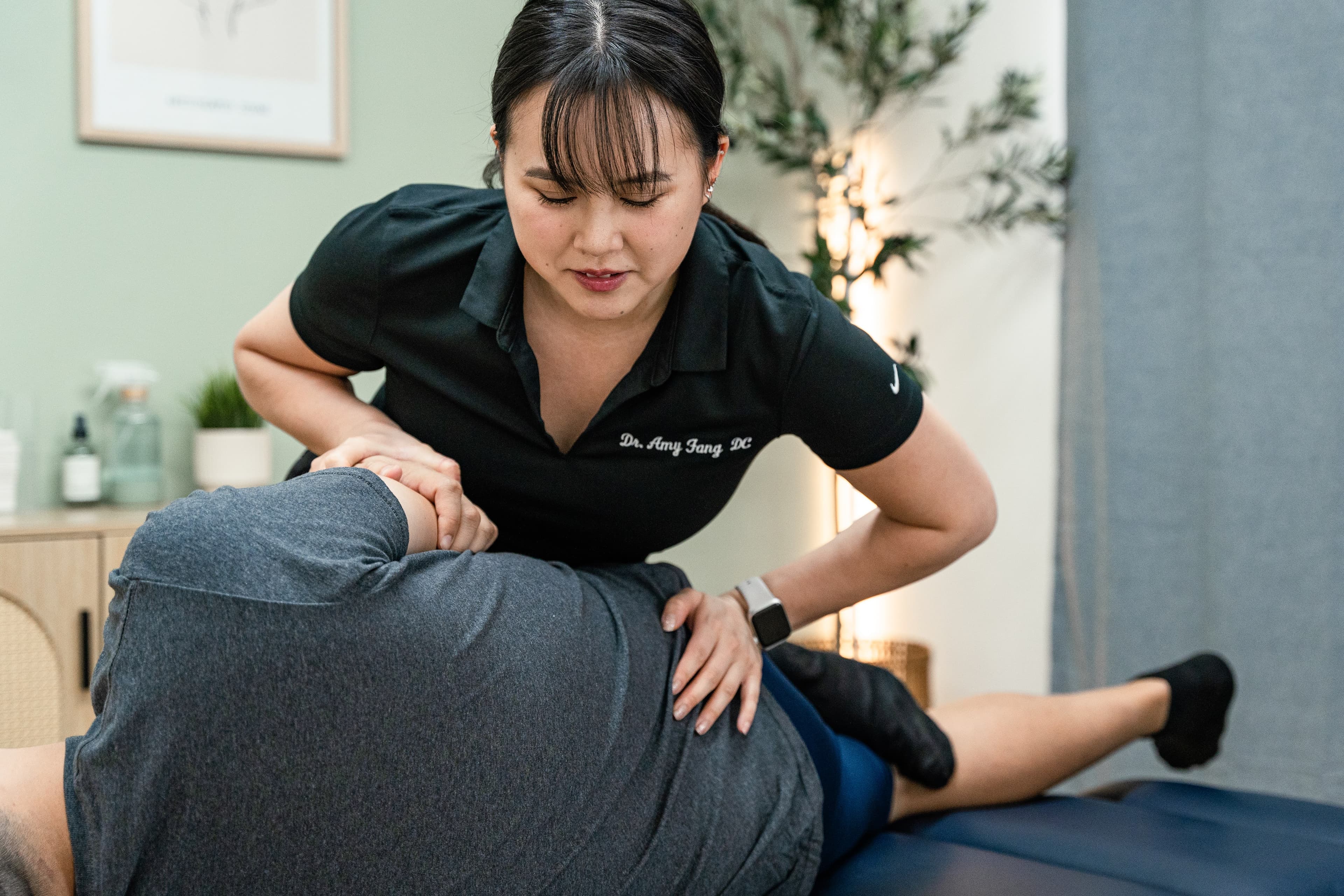 Dr. Amy Fang adjusting a patient